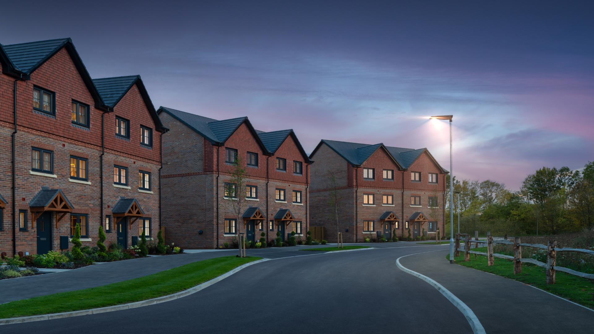 Brick homes at Windsor Gate photographed at dusk